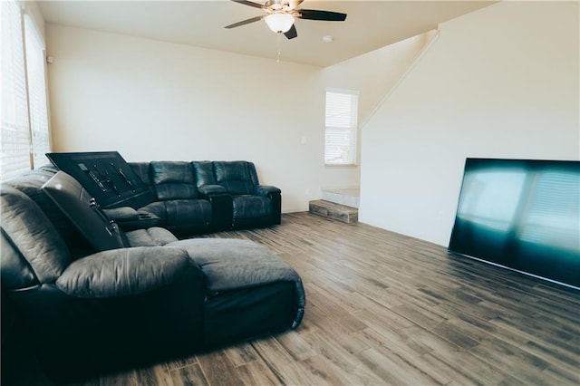 living room featuring a ceiling fan and wood finished floors