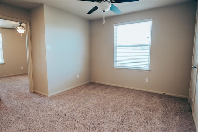 192 Falcon Dr, Luling, TX 78648 - carpeted empty room featuring ceiling fan, plenty of natural light, and baseboards