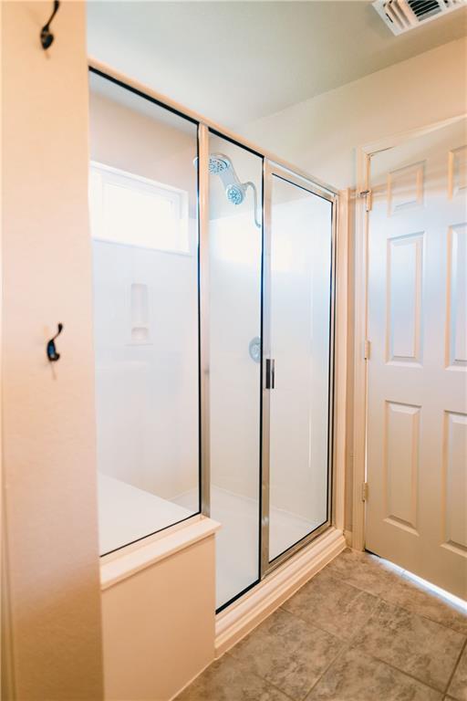 full bath featuring a stall shower