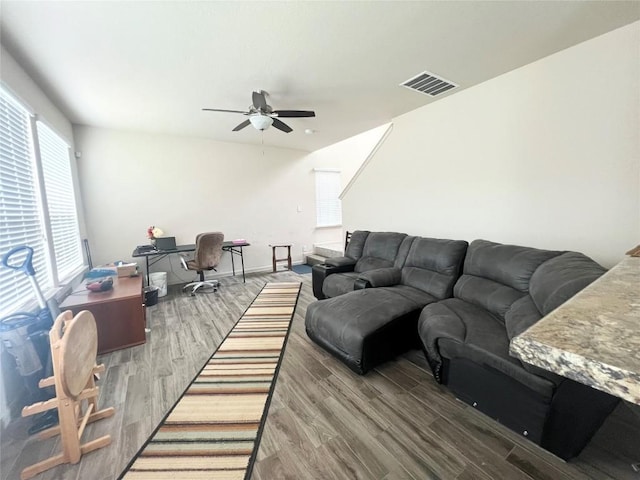 192 Falcon Dr, Luling, TX 78648 - living area with ceiling fan, a desk, and wood finished floors
