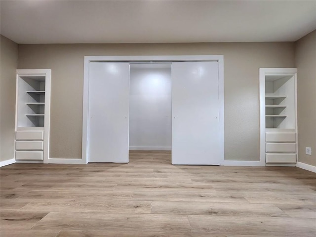 1011 N State Highway 95 N, Bastrop, TX 78602 - unfurnished bedroom with wood finished floors and a closet