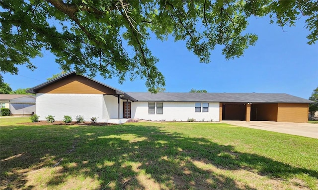 1011 N State Highway 95 N, Bastrop, TX 78602 - view of front of home featuring a front yard, concrete driveway, and a garage