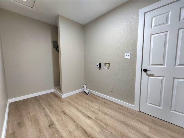 1011 N State Highway 95 N, Bastrop, TX 78602 - laundry area with hookup for an electric dryer, light wood-style floors, and baseboards