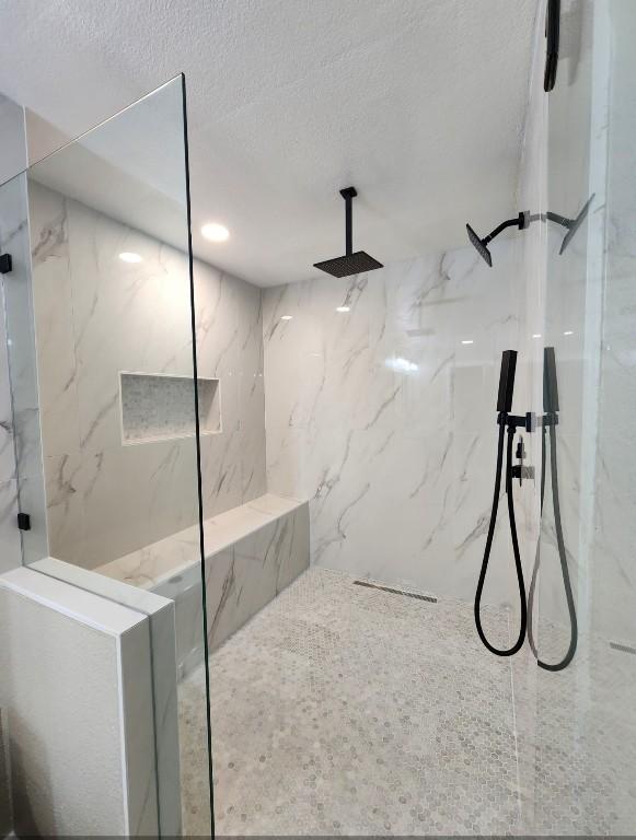 1011 N State Highway 95 N, Bastrop, TX 78602 - bathroom with a marble finish shower and a textured ceiling