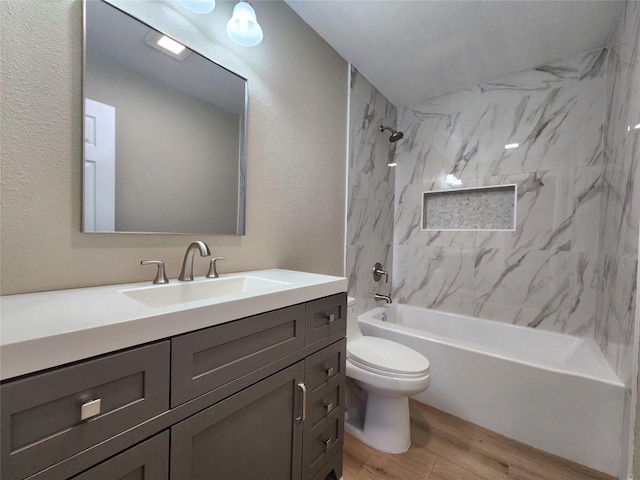 1011 N State Highway 95 N, Bastrop, TX 78602 - bathroom with vanity, toilet, wood finished floors,  shower combination, and a textured wall