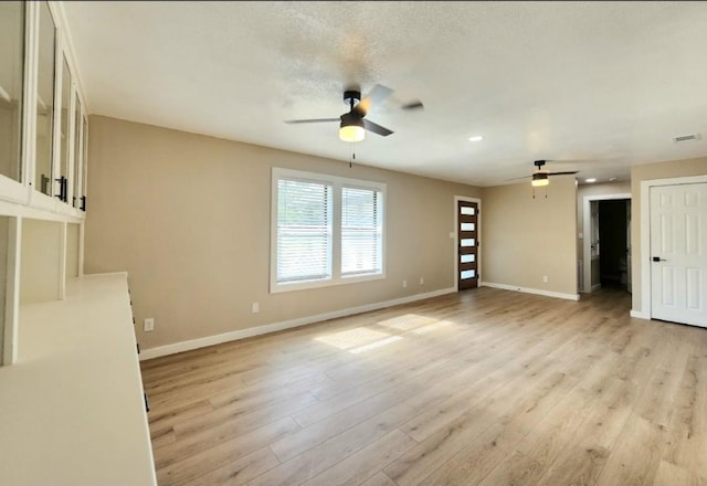 unfurnished living room with ceiling fan, light wood-style flooring, baseboards, and recessed lighting