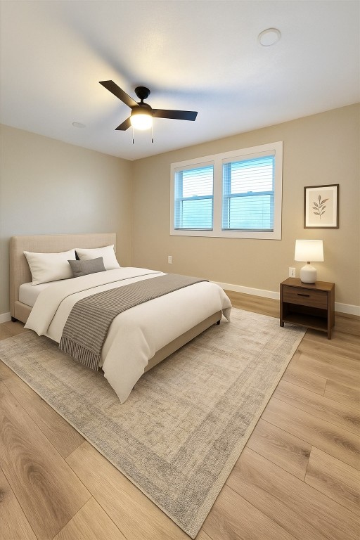 1011 N State Highway 95 N, Bastrop, TX 78602 - bedroom with light wood finished floors and a ceiling fan