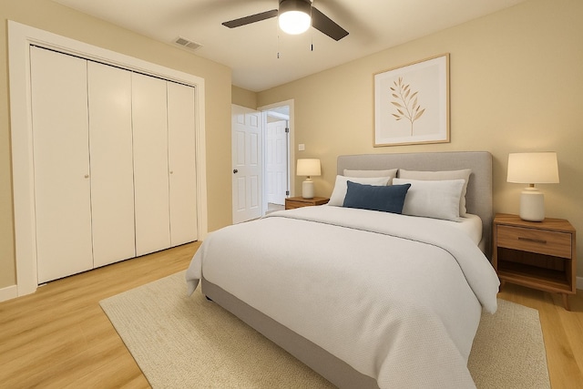 1011 N State Highway 95 N, Bastrop, TX 78602 - bedroom featuring light wood finished floors, a closet, and a ceiling fan