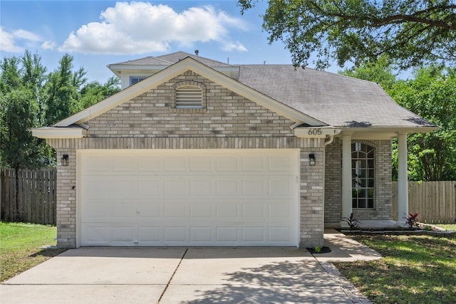 605 Swanson Cv, Austin, TX 78748 - view of front of property with brick siding, driveway, a garage, and a shingled roof