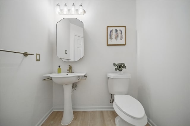 605 Swanson Cv, Austin, TX 78748 - bathroom with toilet and wood finished floors
