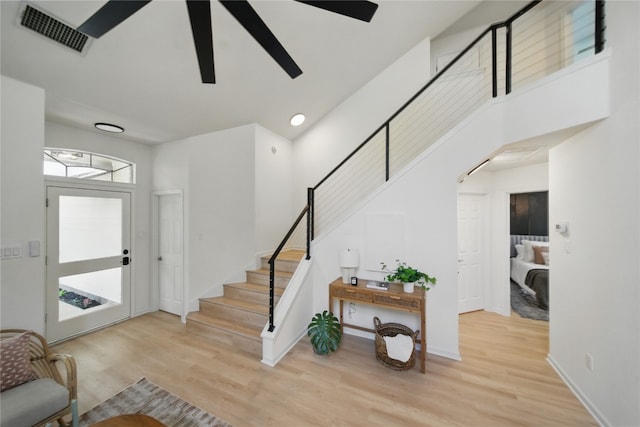 605 Swanson Cv, Austin, TX 78748 - entryway with stairway, wood finished floors, and ceiling fan