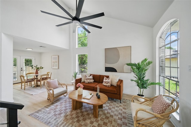 605 Swanson Cv, Austin, TX 78748 - living area featuring healthy amount of natural light, high vaulted ceiling, ceiling fan, and wood finished floors