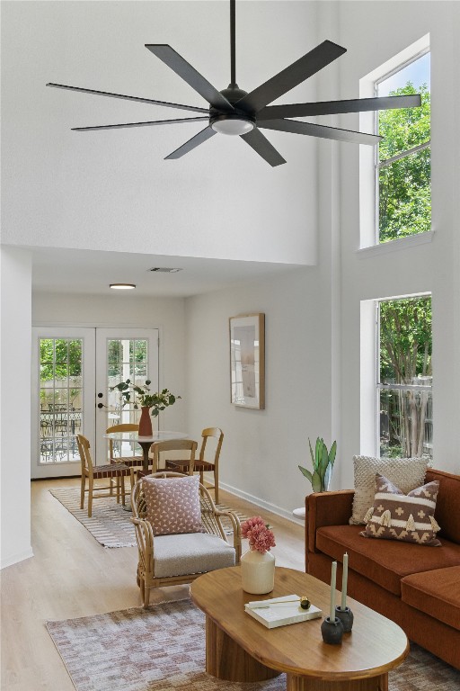 605 Swanson Cv, Austin, TX 78748 - living area with a towering ceiling, light wood-style flooring, and ceiling fan