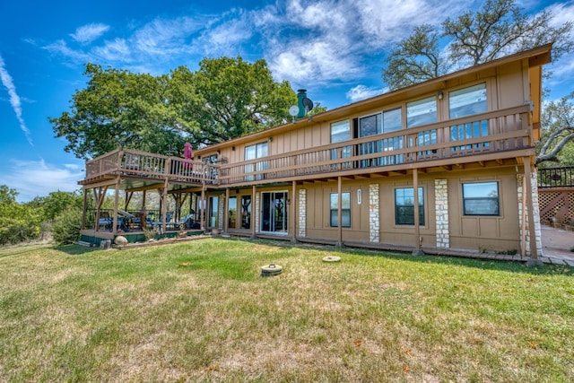 104 Derringer, Horseshoe Bay, TX 78657 - rear view of property featuring a wooden deck, a yard, and board and batten siding
