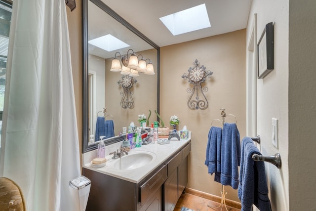 104 Derringer, Horseshoe Bay, TX 78657 - full bath featuring a skylight, vanity, and baseboards