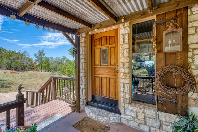 104 Derringer, Horseshoe Bay, TX 78657 - doorway to property with stone siding and a porch