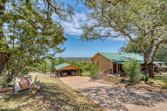 104 Derringer, Horseshoe Bay, TX 78657 - view of yard featuring a carport, driveway, and covered porch