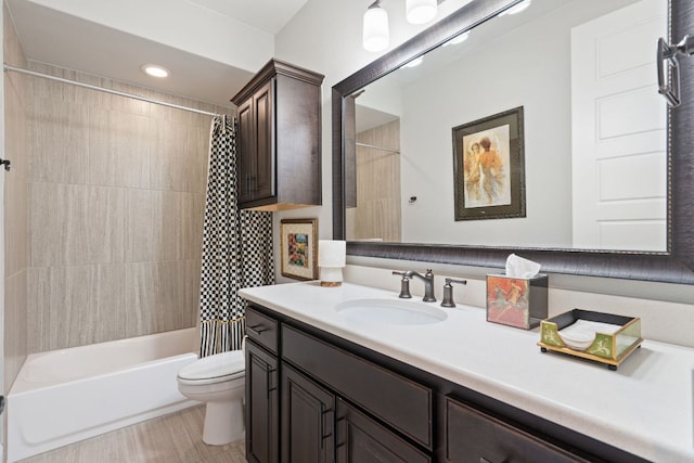 full bath with toilet, vanity, and shower / tub combo with curtain