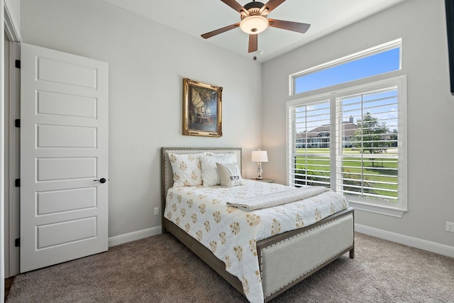 bedroom with carpet, baseboards, and a ceiling fan