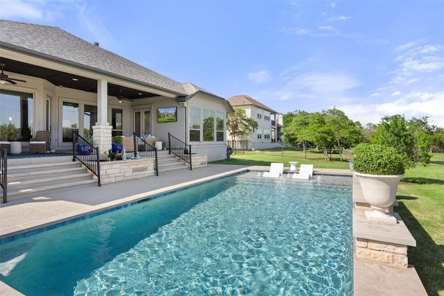 outdoor pool featuring ceiling fan and a patio area