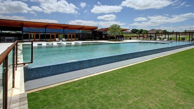 community pool featuring a yard