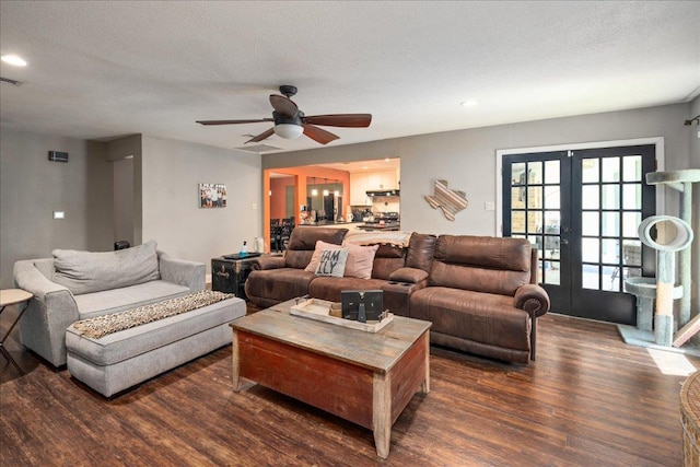 1619 Twin Island Dr, Lockhart, TX 78644 - living area featuring dark wood-style flooring, french doors, ceiling fan, recessed lighting, and a textured ceiling