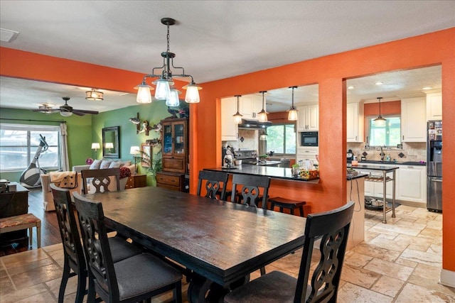 1619 Twin Island Dr, Lockhart, TX 78644 - dining room featuring stone tile floors and a ceiling fan