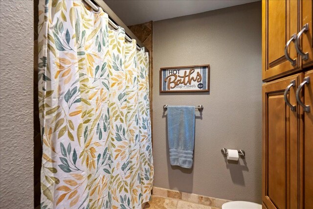 1619 Twin Island Dr, Lockhart, TX 78644 - full bath featuring toilet, a shower with shower curtain, and tile patterned flooring