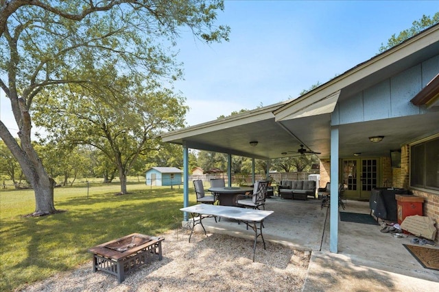 1619 Twin Island Dr, Lockhart, TX 78644 - view of patio / terrace with an outdoor living space with a fire pit and ceiling fan