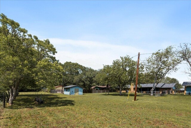 1619 Twin Island Dr, Lockhart, TX 78644 - view of yard featuring an outbuilding