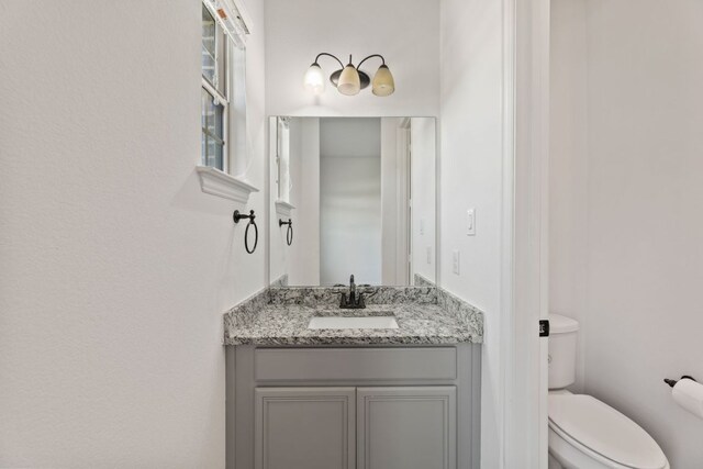 half bath with toilet and vanity