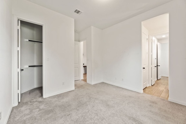 4700 Topacio Dr, Spicewood, TX 78669 - unfurnished bedroom with carpet, a spacious closet, and a closet