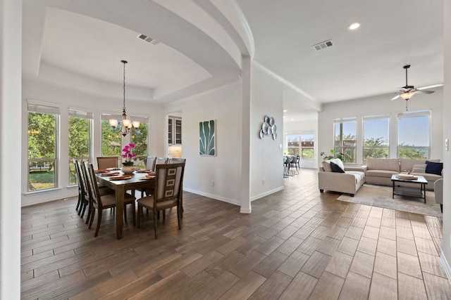 dining area featuring baseboards, healthy amount of natural light, dark wood finished floors, a ceiling fan, and recessed lighting
