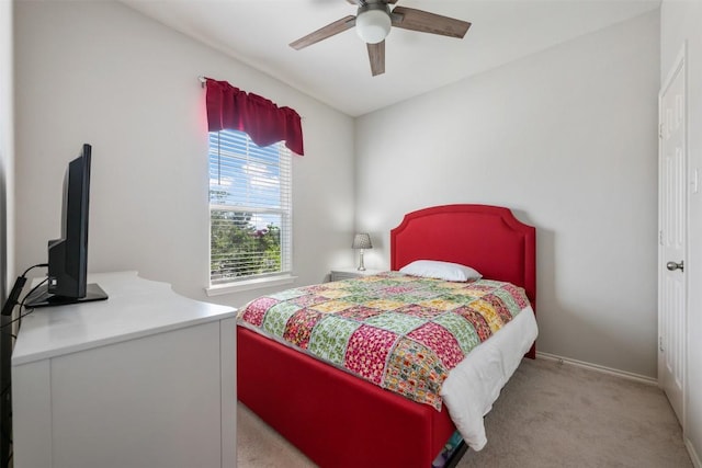 651 Bayberry Cir, Buda, TX 78610 - bedroom with light carpet, baseboards, and ceiling fan