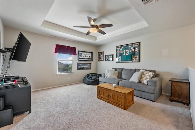 651 Bayberry Cir, Buda, TX 78610 - living area featuring ceiling fan, a tray ceiling, carpet floors, and baseboards