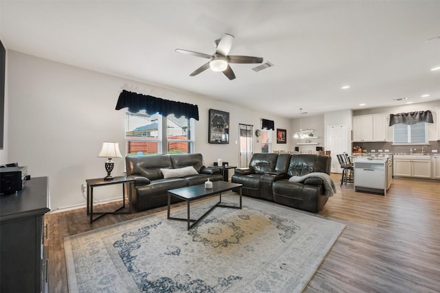 651 Bayberry Cir, Buda, TX 78610 - living area featuring a ceiling fan, wood finished floors, and recessed lighting