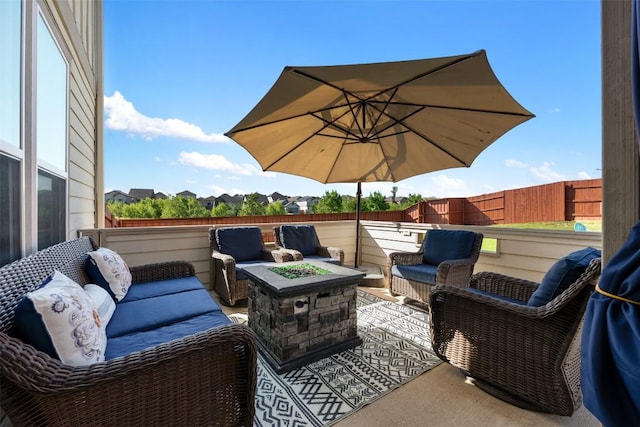 651 Bayberry Cir, Buda, TX 78610 - view of patio / terrace featuring an outdoor living space with a fire pit and fence