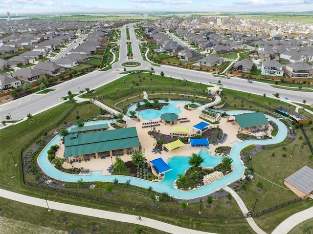 651 Bayberry Cir, Buda, TX 78610 - aerial overview of property's location featuring a pool and nearby suburban area