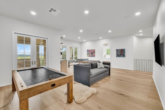 3204 Aztec Fall Cv, Austin, TX 78746 - playroom with french doors, light wood-style floors, recessed lighting, and baseboards