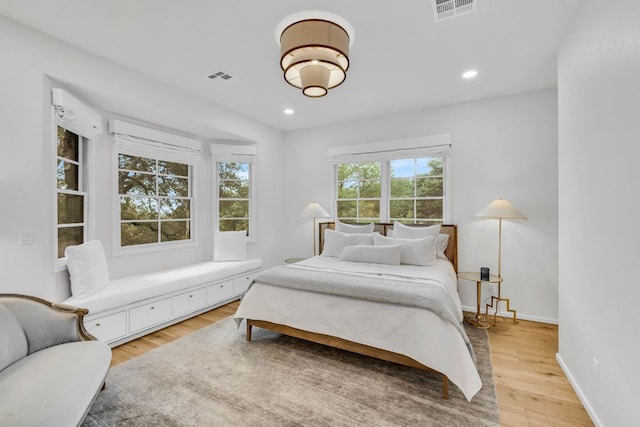 3204 Aztec Fall Cv, Austin, TX 78746 - bedroom with light wood finished floors, baseboards, and recessed lighting