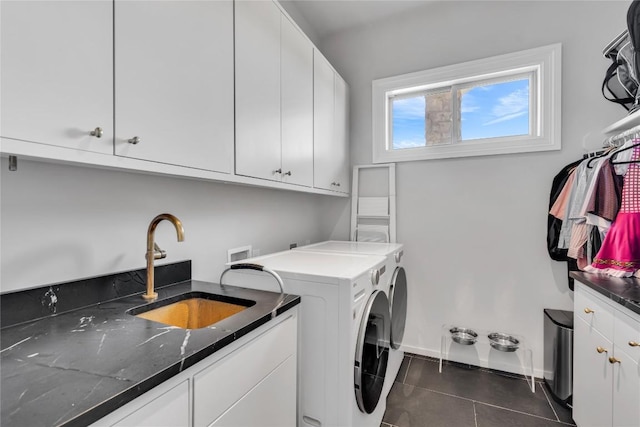 3204 Aztec Fall Cv, Austin, TX 78746 - washroom with independent washer and dryer, cabinet space, dark tile patterned flooring, and baseboards