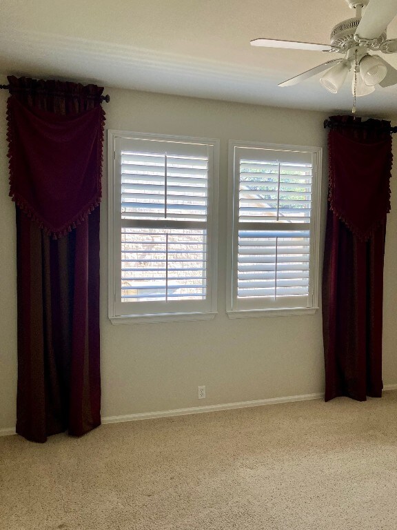 209 Country Creek Dr, Austin, TX 78737 - carpeted spare room featuring a ceiling fan and baseboards