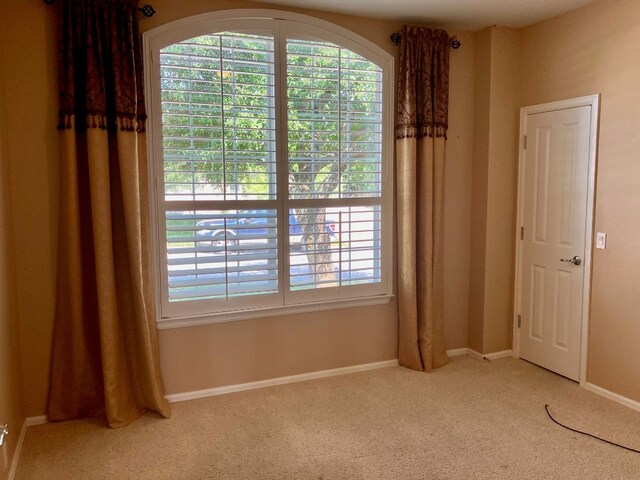 209 Country Creek Dr, Austin, TX 78737 - carpeted spare room featuring baseboards