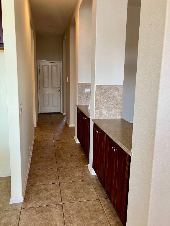 209 Country Creek Dr, Austin, TX 78737 - corridor with light tile patterned floors and baseboards