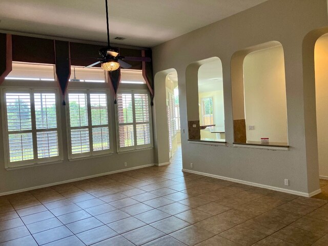 209 Country Creek Dr, Austin, TX 78737 - unfurnished dining area with a ceiling fan, plenty of natural light, and tile patterned flooring