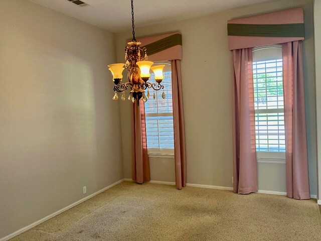 209 Country Creek Dr, Austin, TX 78737 - unfurnished room featuring a chandelier, carpet flooring, and baseboards