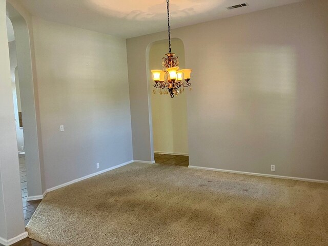 209 Country Creek Dr, Austin, TX 78737 - unfurnished room with arched walkways, a chandelier, carpet, and baseboards