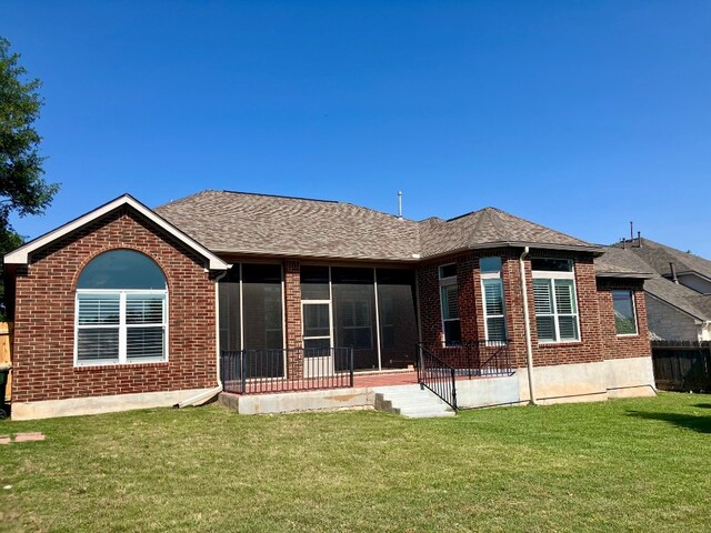 209 Country Creek Dr, Austin, TX 78737 - back of house with brick siding, a sunroom, and a shingled roof