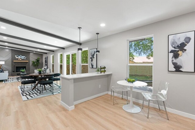 10107 E Rutland Vlg, Austin, TX 78758 - kitchen featuring healthy amount of natural light, light wood finished floors, recessed lighting, and beamed ceiling