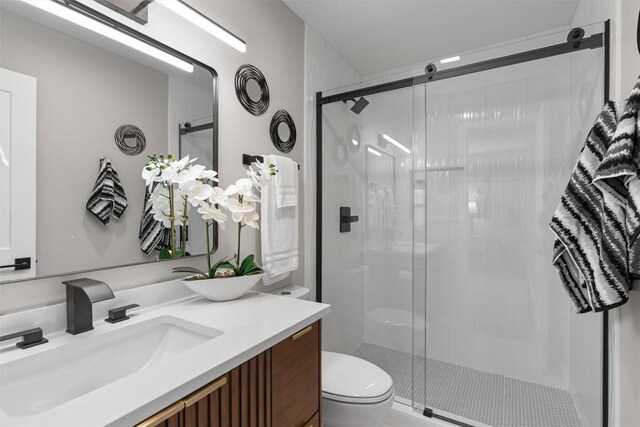 10107 E Rutland Vlg, Austin, TX 78758 - bathroom featuring vanity and a shower stall